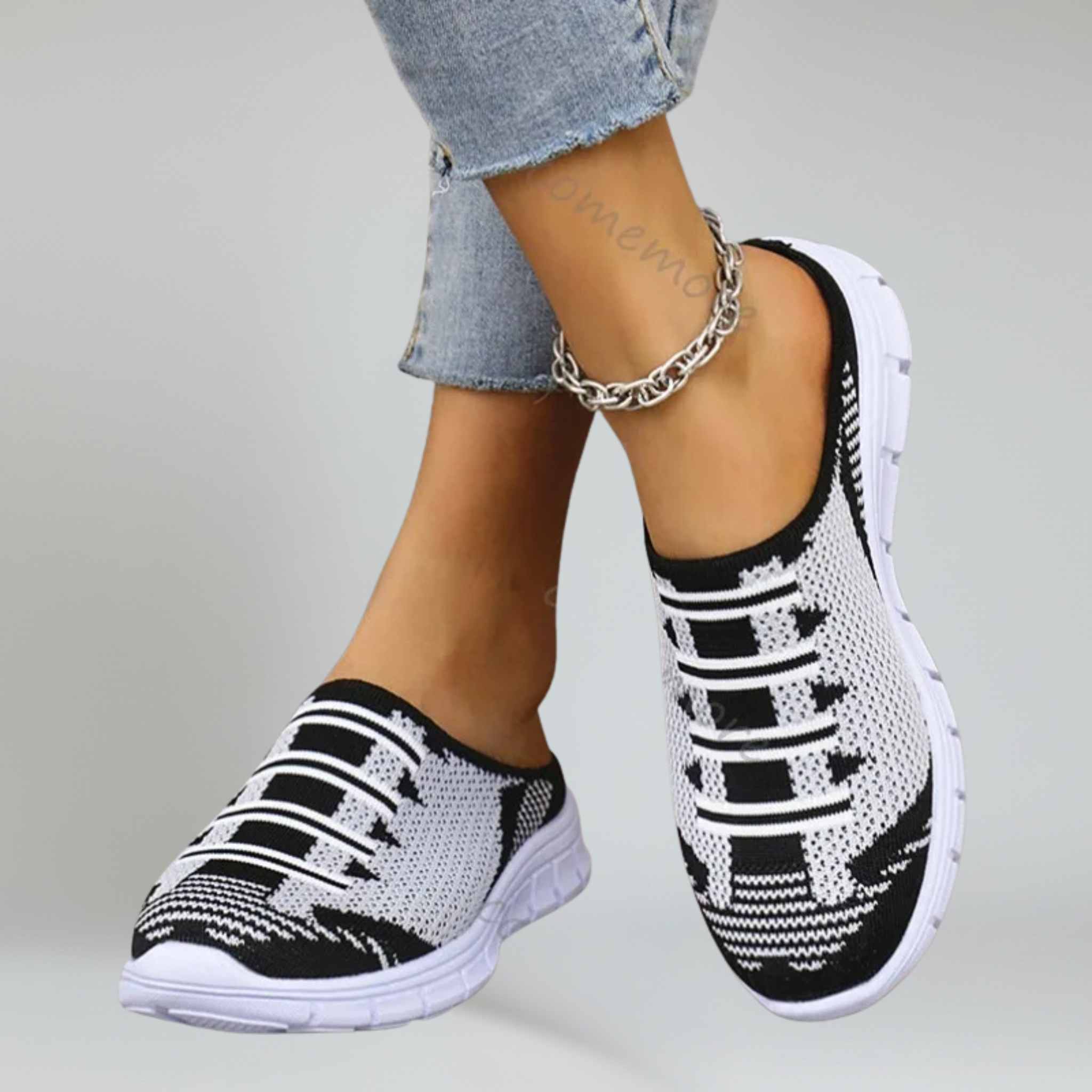 a pair of pink lightweight footwear on a plain background