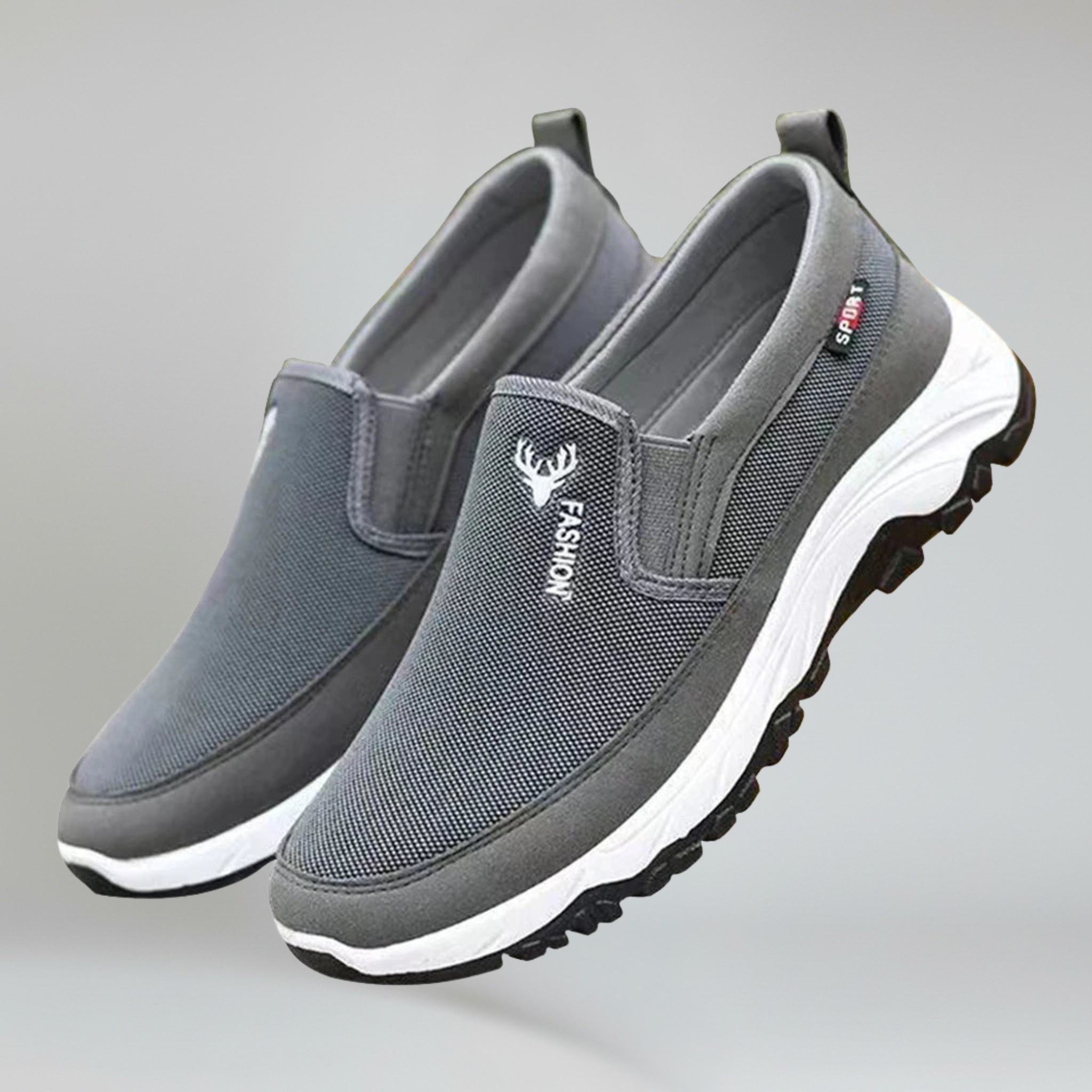 a pair of grey boat shoes for men on a plain background