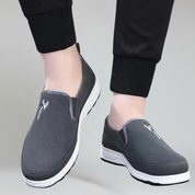 men's grey footwear on a plain background