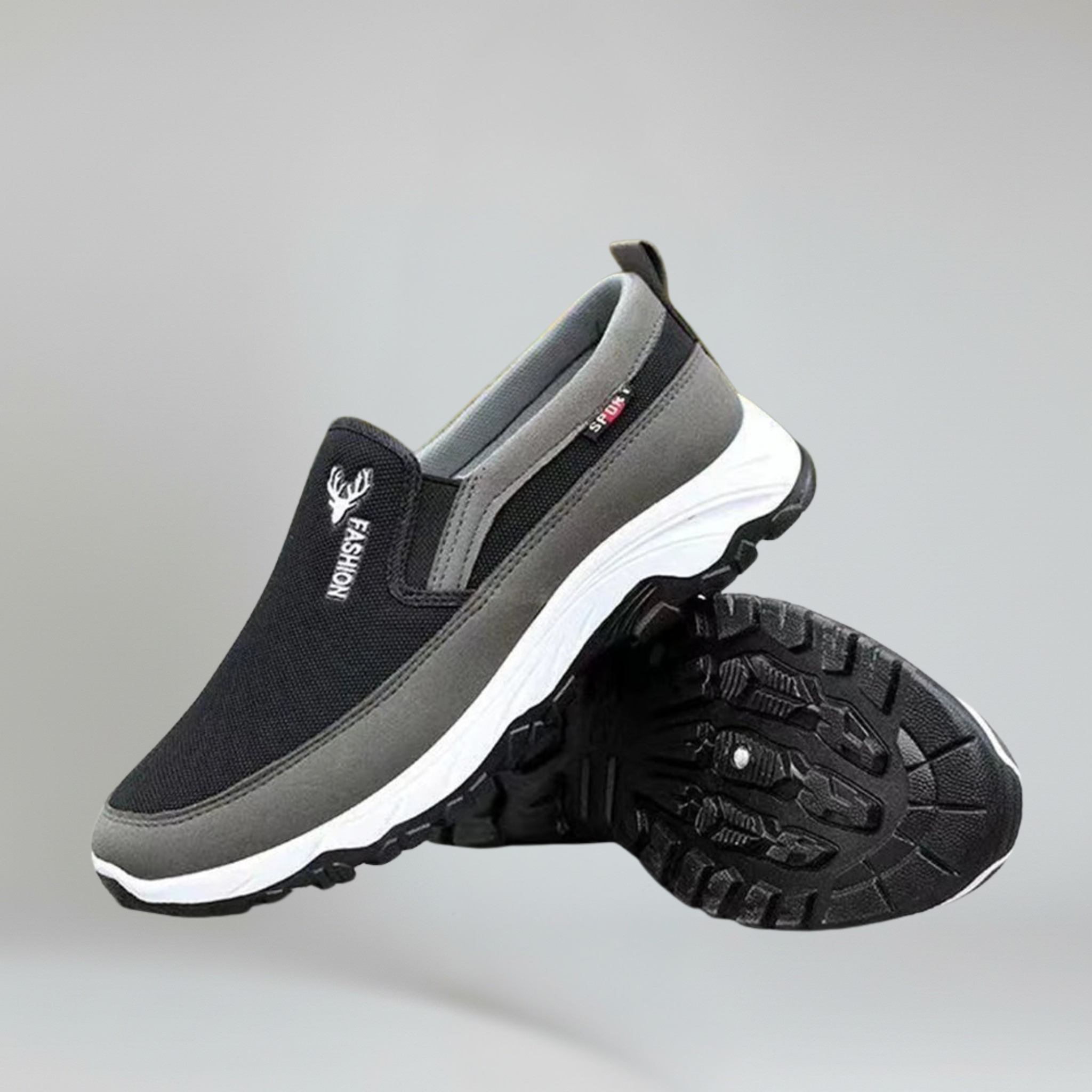 a pair of black boat shoes for men on a plain background