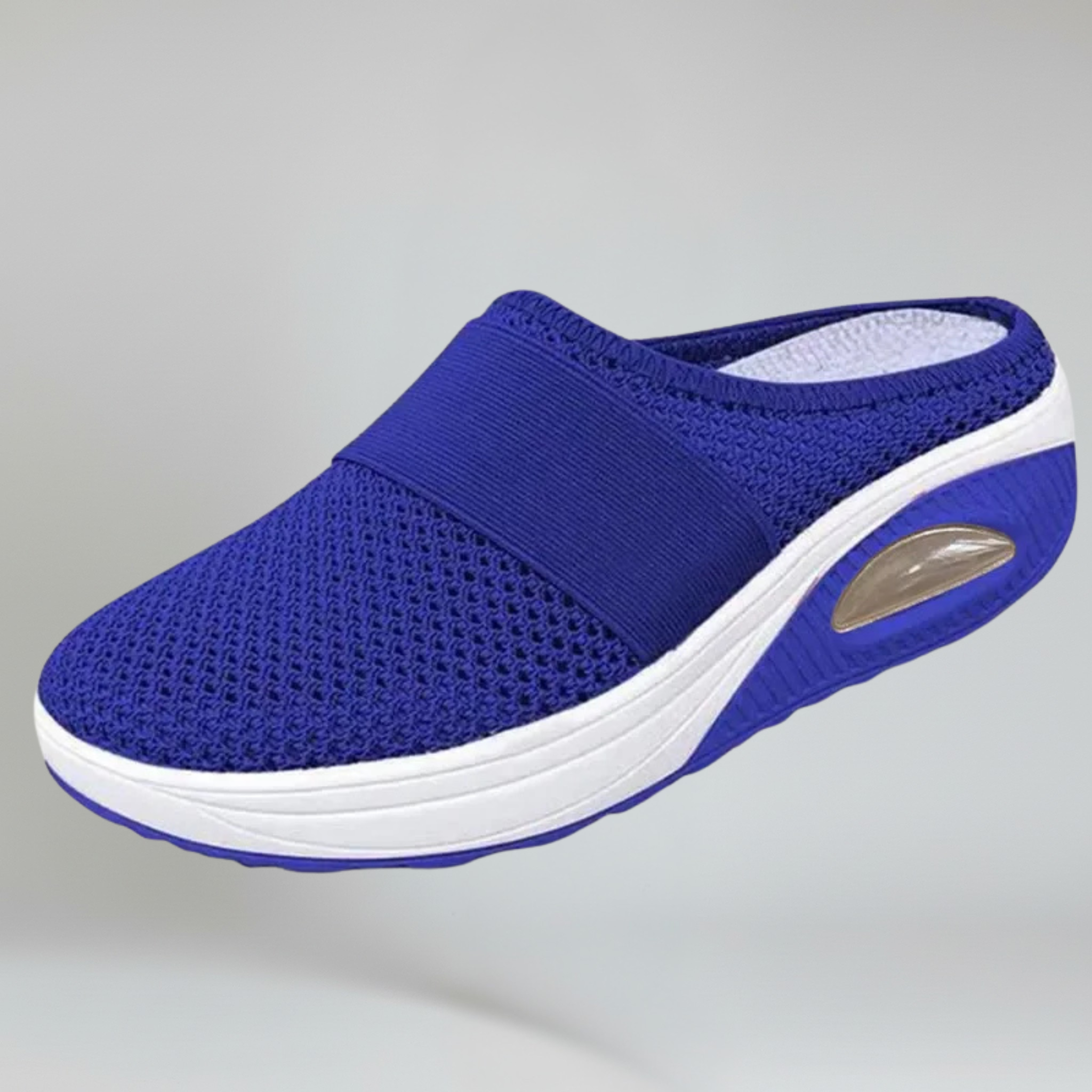 blue wedge slipper on a plain background