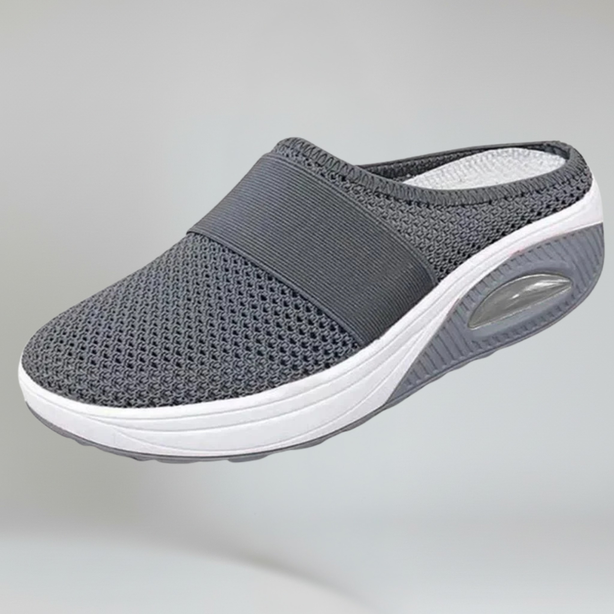 grey wedge slipper on a plain background