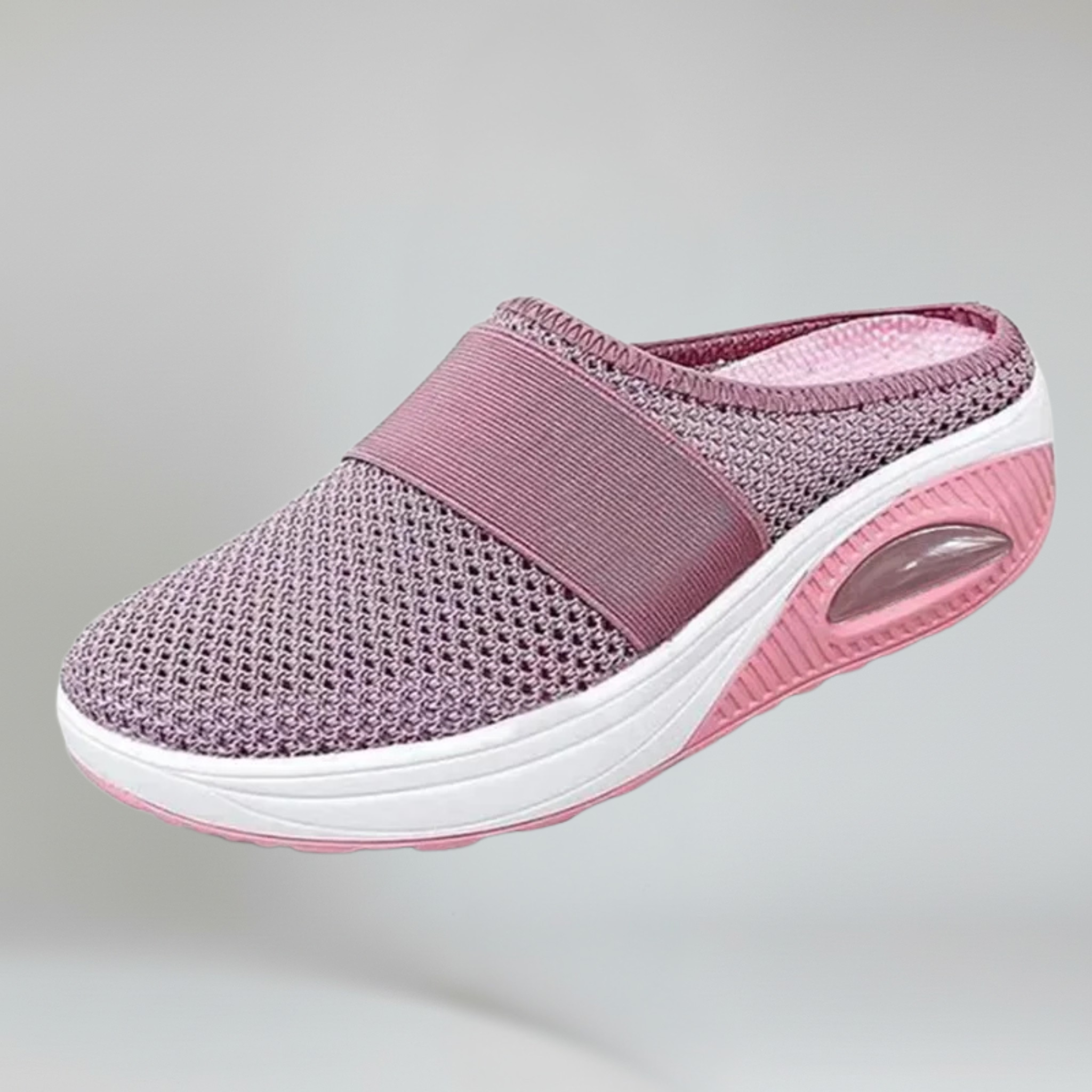 pink wedge slipper on a plain background