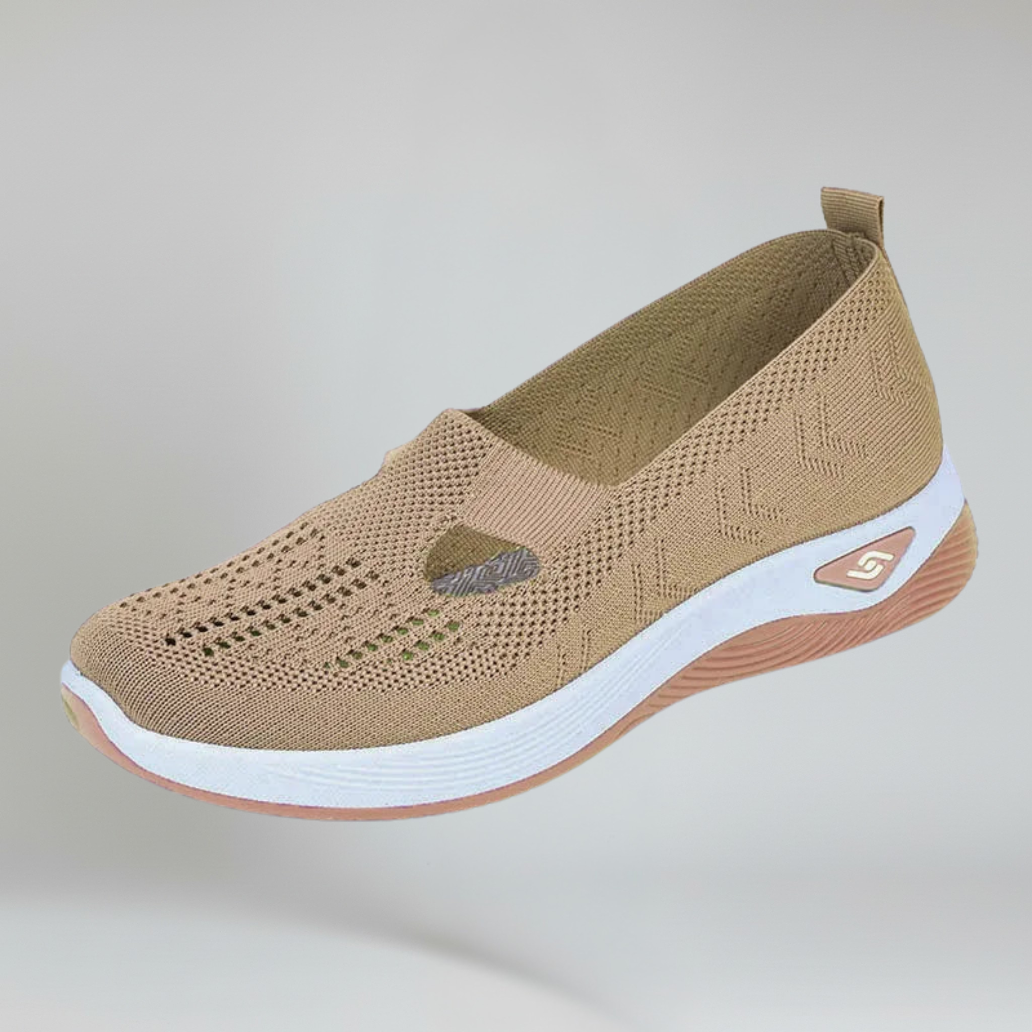 women's brown slip-on sneakers on a plain background