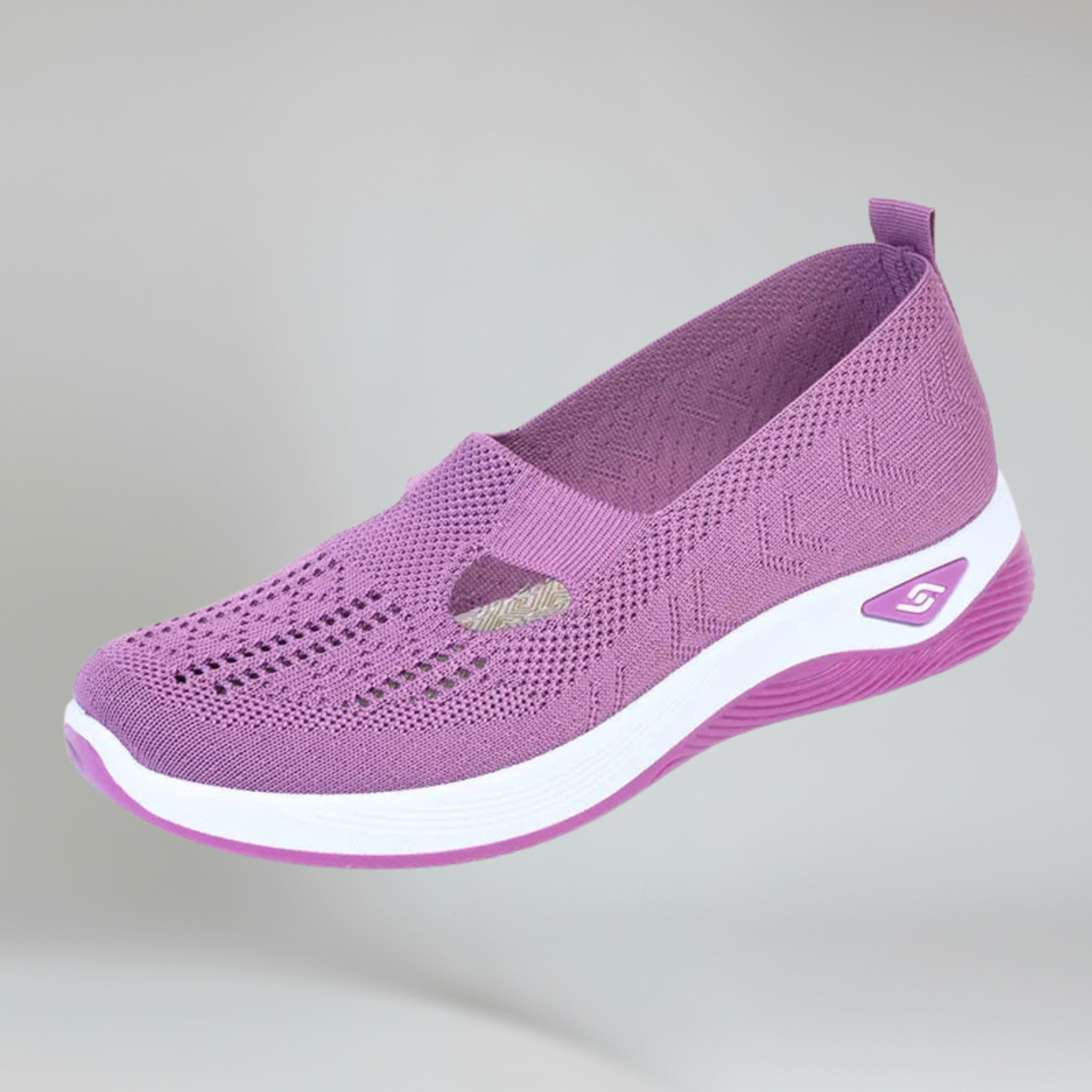 women's purple slip-on sneakers on a plain background