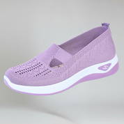 women's lavender slip-on sneakers on a plain background