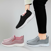 three pairs of walking shoes on a plain background