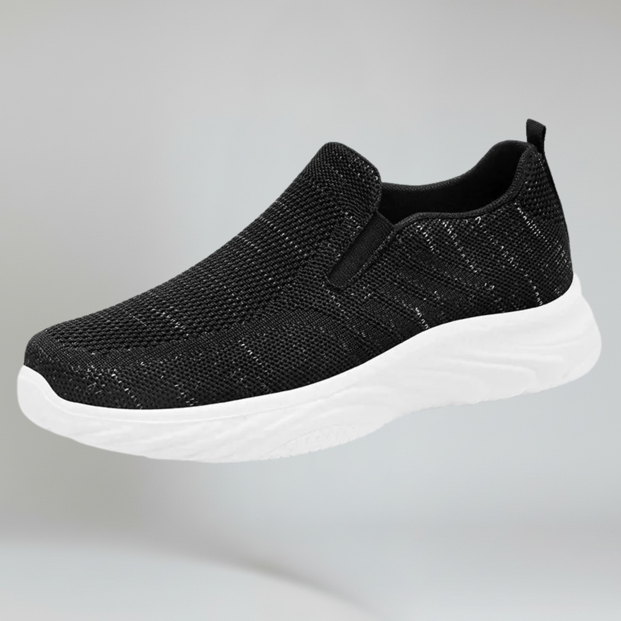 black walking shoes on a plain background